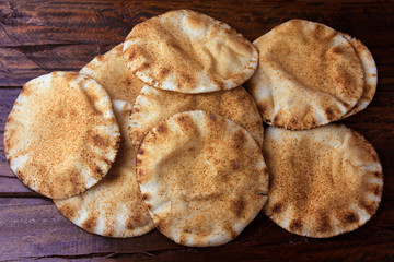 Pita bread isolated on rustic wooden table.Traditional food of Arabic cuisine