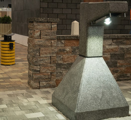 Obraz premium close-up modern solid concrete street lantern at city park