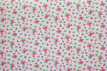 A piece of fabric with the image of small flowers in pastel colors