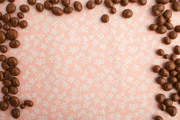 chocolates with peanuts on fabric background