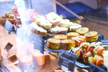 Tapas on Crusty Bread - Selection of Spanish tapas served on a sliced baguette.