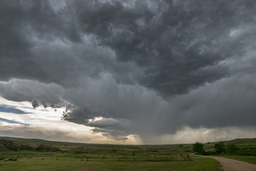 Naklejka na ściany i meble A rotating thunderstorm, also known as a supercell, over the grasslands of northeastern Wyoming