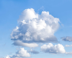 Naklejka na ściany i meble White clouds against blue sky as a backdrop