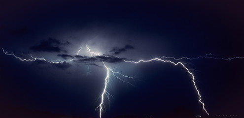 Two bright lightning bolts strike in the vicinity of Gouda, The Netherlands from a violent...