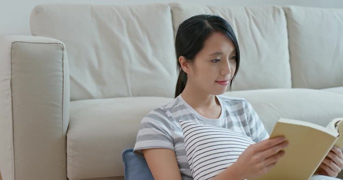 Woman read on book at home