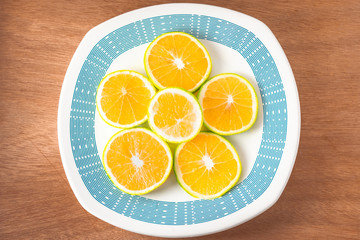 Oranges with a plate