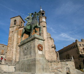 Fototapeta na wymiar Saint Martin's church and statue of Fransisco Pizarro. Trujillo. Spain
