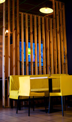 Beautiful yellow table in the cafe for guests