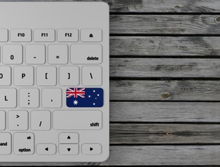 Australia flag enter key on white keyboard, on wood background. 3d render