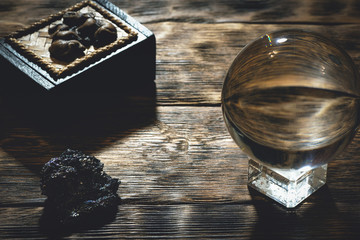 Crystal ball on the magic table background. Future reading.