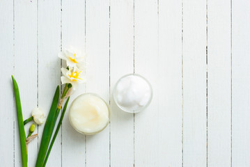 Moisturizer and daffodil flower