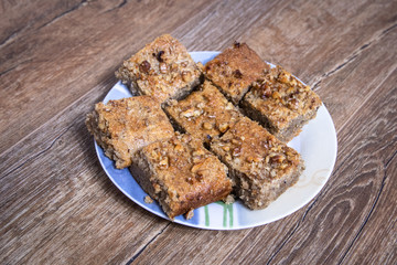Homemade cookies with walnuts on vintage wooden table