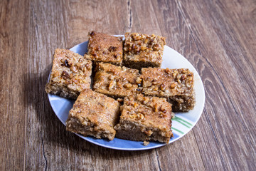 Homemade cookies with walnuts on vintage wooden table