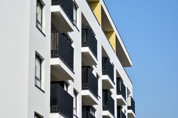 European modern residential architecture. Fragment of a modern apartment building in front. Very modern apartment house. 