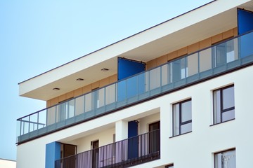 European modern residential architecture. Fragment of a modern apartment building in front. Very modern apartment house. 