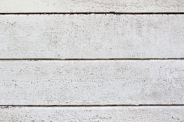 White plank wall with cracked paint