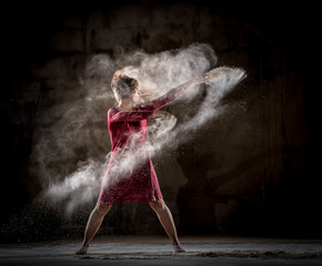 Young woman between fog in darkness