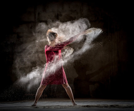 Young woman between fog in darkness