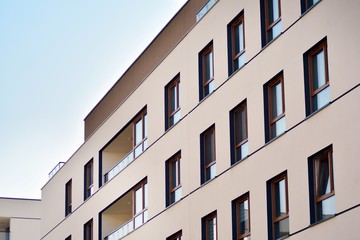 European modern residential architecture. Fragment of a modern apartment building in front. Very modern apartment house. 