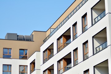 European modern residential architecture. Fragment of a modern apartment building in front. Very modern apartment house. 