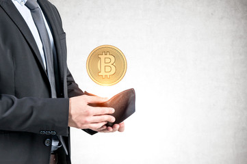 Man opens wallet with bitcoin