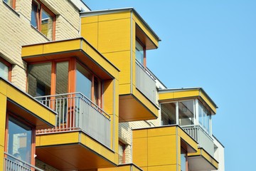 European modern residential architecture. Fragment of a modern apartment building in front. Very modern apartment house. 