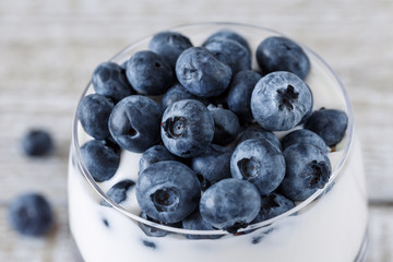 Ripe blueberries on yogurt