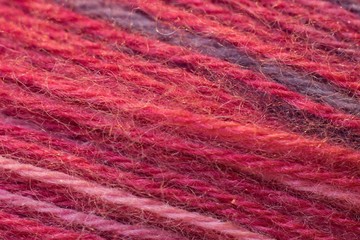 Red cotton on sewing detail background