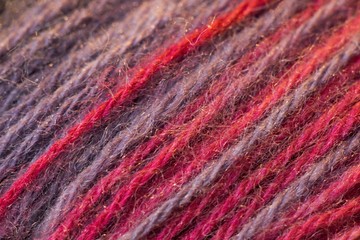 Red cotton on sewing detail background