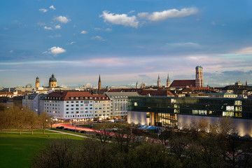 Munich Skyline at sunset - Frauenkirche, Theatiner Church, Alps visible in background