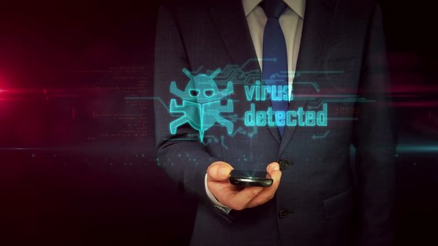 Virus detected concept. Businessman in suit using smartphone with worm and warning hologram. Danger alert, crime, threat and attack abstract concept with skull symbol. Futuristic 3D animation.