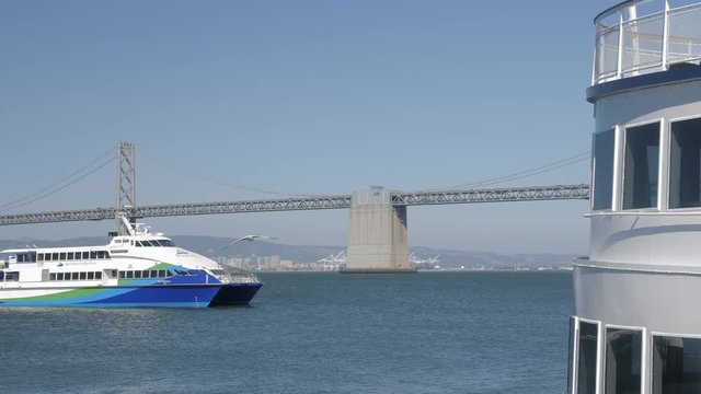 View of ferry and Oakland Bay Bridge from Pier 1, San Francisco, California, USA