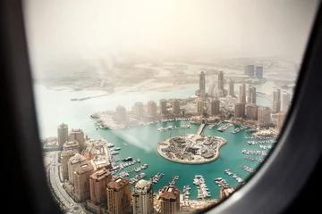 Fotobehang Doha, the capital of the state of Qatar. View from the airplane window. © 9parusnikov