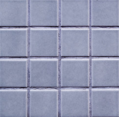 gray tiled wall close-up texture. background, interior.