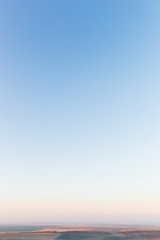 Obraz premium blue sky and fog over the field. autumn evening. landscape