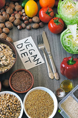 A set of products for a vegan diet. Fruits, vegetables, seeds, cereals, nuts. A note with an inscription vegan diet. Flat Lay.
