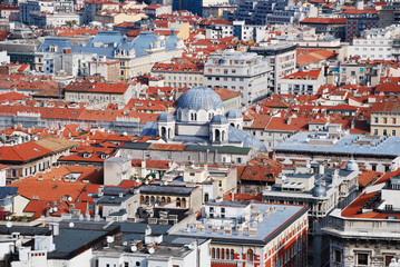 Fototapeta na wymiar Aerial view of Trieste focused on the dome of Saint Spyridon church, Italy