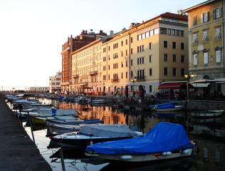 The buildings of Trieste at sunset, Italy