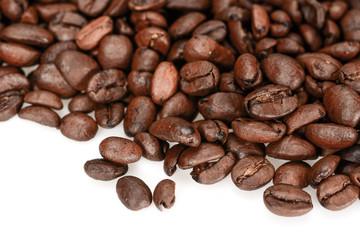 Roasted coffee beans, dark brown close up isolated on a white background