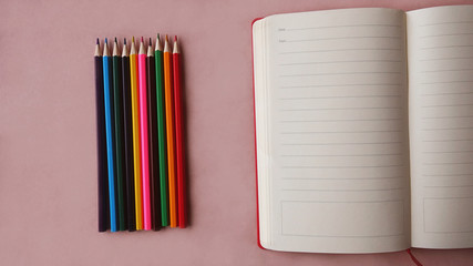                  Office workstation on a wooden table. The accountant's desk includes a coffee cup, pencil, notebook, colored pencils, pen, glasses, stickers, clips, calculator