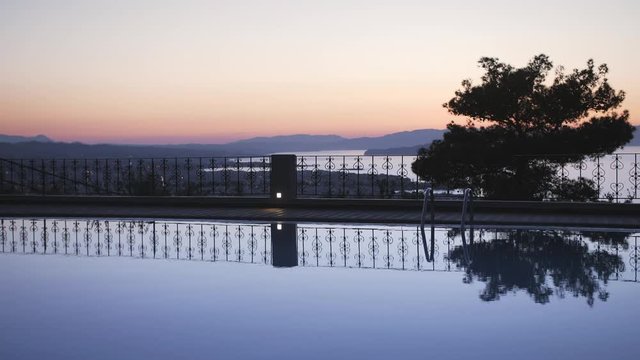 Largre swimming pool and sunset over Chania, Cretea