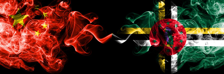 China vs Dominica smoke flags placed side by side. Thick colored silky smoke flags of Chinese and Dominica