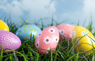 Decorated Easter Eggs Hiding in the Grass on a Beautiful Spring Day