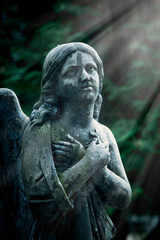 Fototapeta na wymiar Sad angel. Antique statue. Religion, Christianity, faith, immortality, concept.