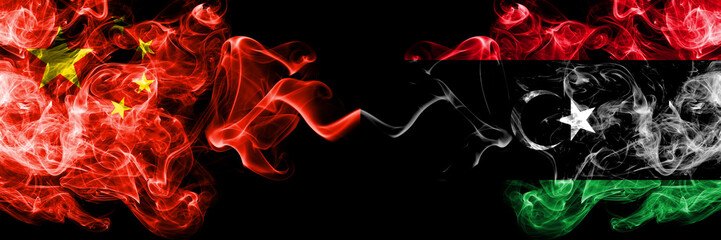 China vs Libya, Libyan smoke flags placed side by side. Thick colored silky smoke flags of Chinese and Libya, Libyan