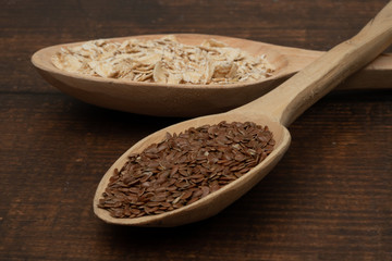 Seeds on a wooden spoon close up