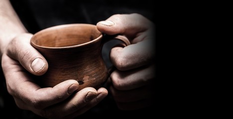 Fototapeta na wymiar Hands of potter making clay pot, closeup photo