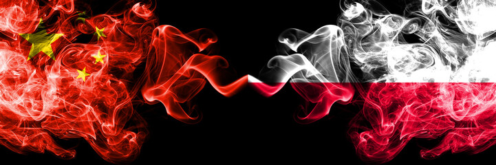 China vs Poland, Polish smoke flags placed side by side. Thick colored silky smoke flags of Chinese and Poland, Polish
