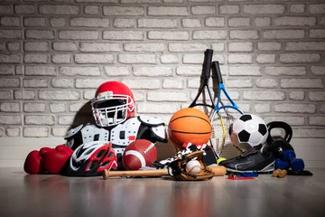 Zelfklevend Fotobehang Sports Equipment On Floor © Andrey Popov