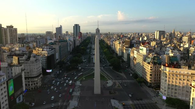 Aerial drone view of Obelisk on avenida de Julio during sunrise in a city downtown. Buenos Aires, Argentina